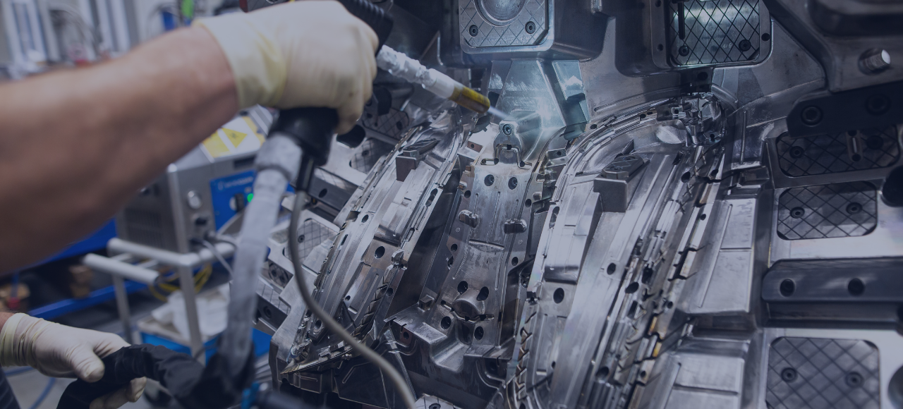 Engineering doing maintenance on injection mold